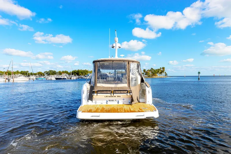 Slide: The Image of 2018 Jeanneau Leader 36 yacht cruising in a sunny marina. - 3