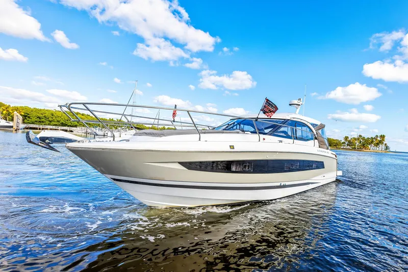 Slide: The Image of 2018 Jeanneau Leader 36 yacht cruising on a sunny day with clear blue skies. - 4