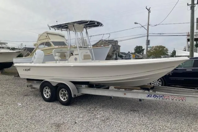 The Image of 2023 Bulls Bay 2400 boat on trailer, parked in a gravel lot. - 0