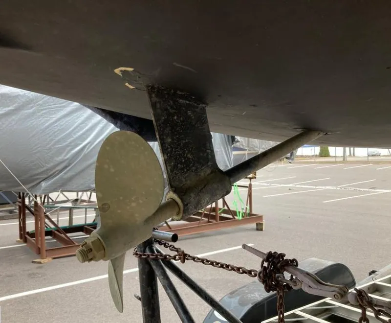 Slide: The Image of Propeller and rudder of a 1997 Catalina MkII sailboat in a parking area. - 13