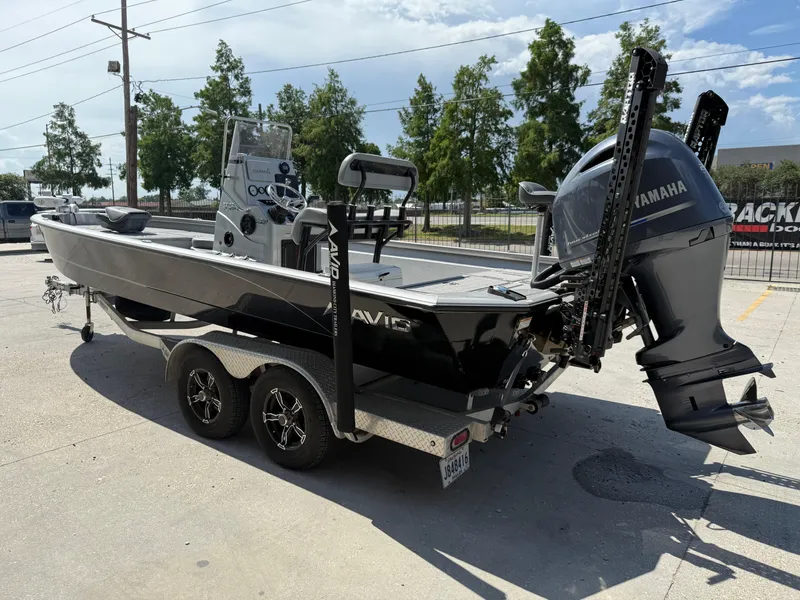 Slide: The Image of Avid FS23 Mag Platinum 2021 boat on trailer under a canopy. - 5
