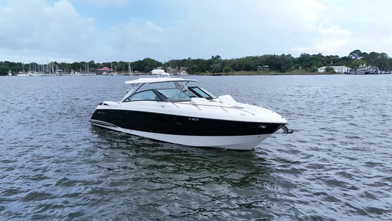 Slide: The Image of 2015 Cobalt A40 boat on calm water with scenic background. - 1
