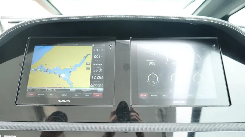 Slide: The Image of Dashboard of 2015 Cobalt A40 with Garmin navigation and control screens. - 12