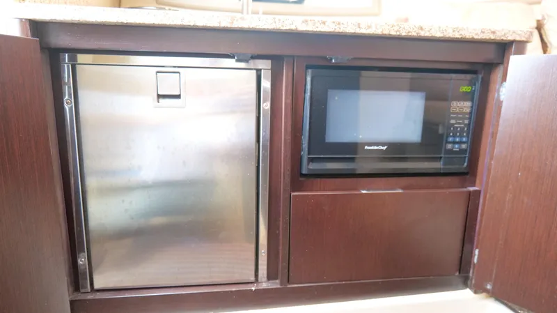 Slide: The Image of Built-in microwave and fridge in 2015 Cobalt A40 yacht kitchen. - 22