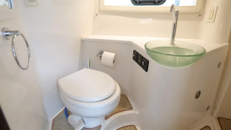 Slide: The Image of Modern bathroom in 2015 Cobalt A40 boat with glass sink and toilet. - 23