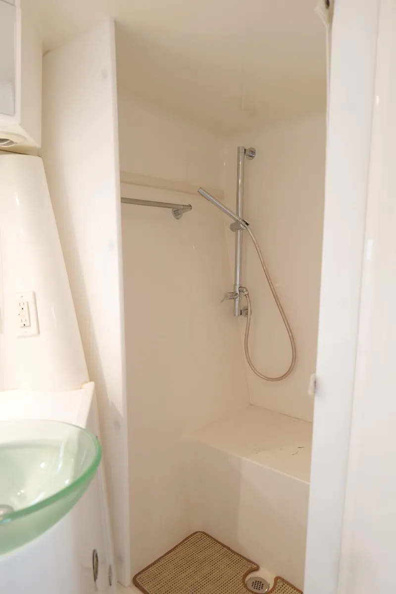 Slide: The Image of 2015 Cobalt A40 boat interior shower with modern fixtures and minimalist design. - 24