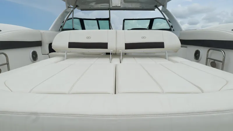 Slide: The Image of 2015 Cobalt A40 boat with luxurious white seating and sleek design. - 33