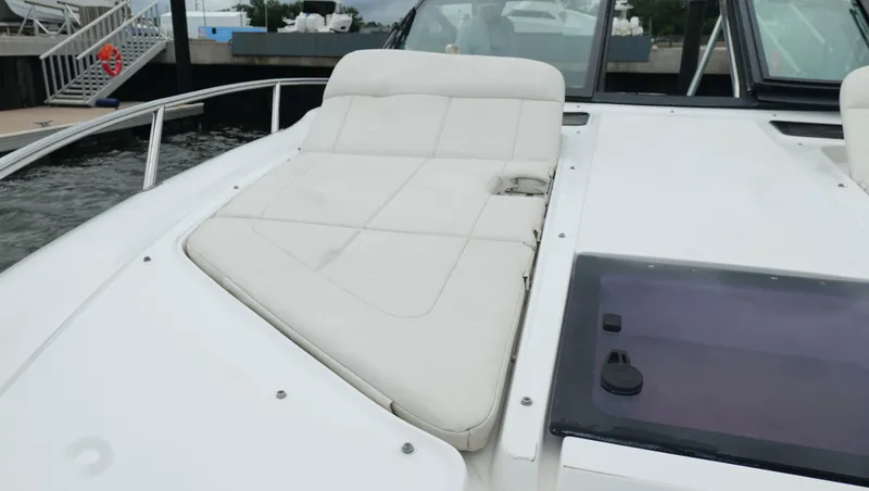 Slide: The Image of 2015 Cobalt A40 boat with white cushioned seating on deck. - 36