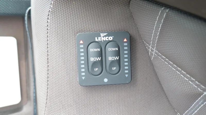 Slide: The Image of Lenco trim tab control panel on 2015 Cobalt A40 boat interior. - 39