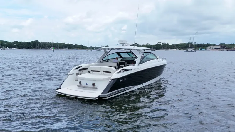 Slide: The Image of 2015 Cobalt A40 boat on calm water under a cloudy sky. - 7
