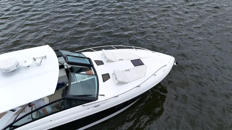 Slide: The Image of 2015 Cobalt A40 boat cruising on open water, top view. - 9