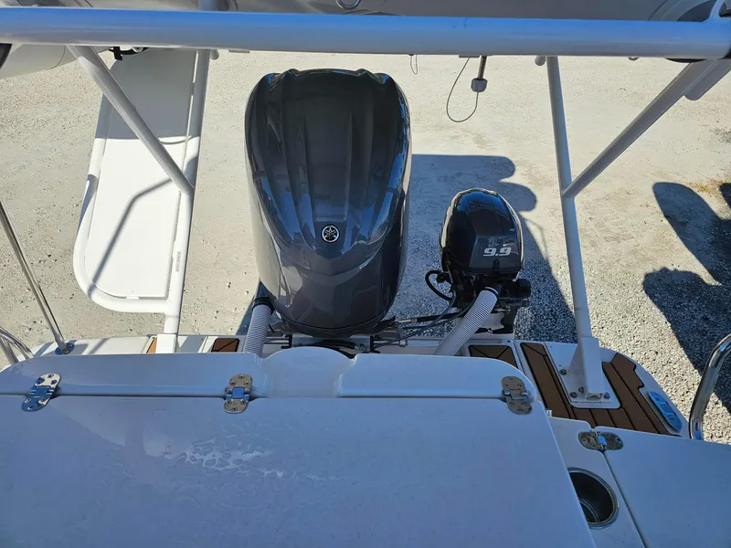 Slide: The Image of 2023 Ranger Tugs 27R boat with dual outboard motors, viewed from above. - 12