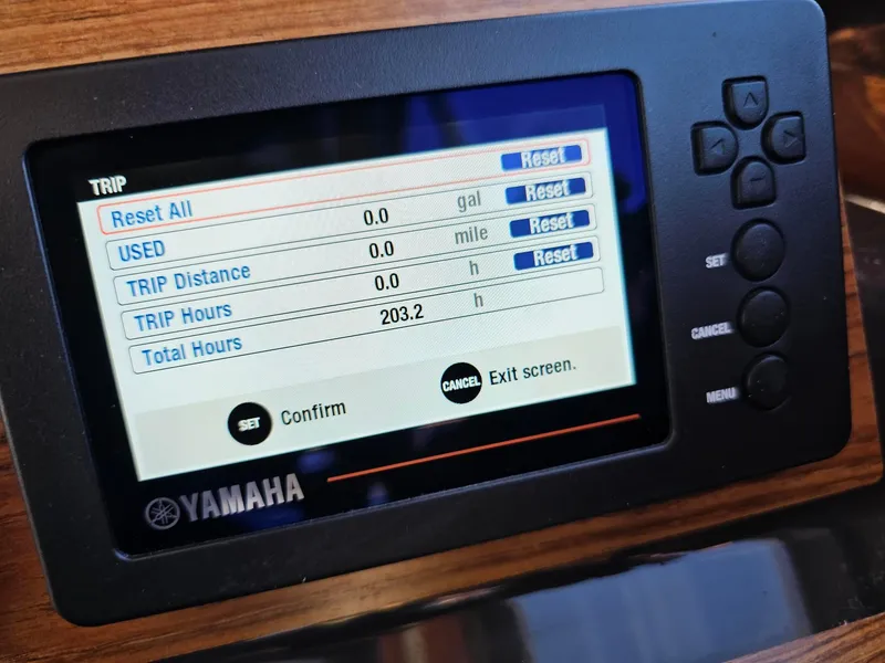 Slide: The Image of Yamaha display on 2023 Ranger Tugs 27R showing trip and total hours. - 17