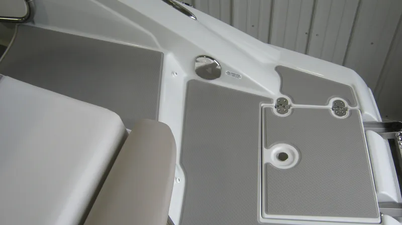 Slide: The Image of 2015 Crownline 285 SS boat deck with gray non-slip surface and seating area. - 12