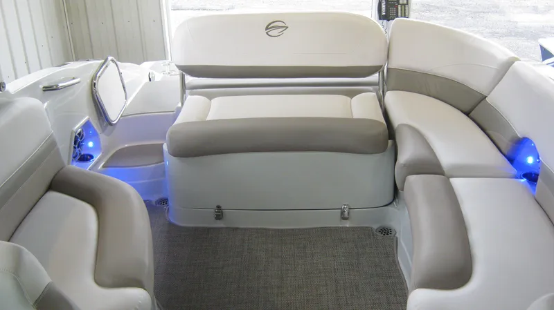 Slide: The Image of Interior seating of a 2015 Crownline 285 SS boat with modern upholstery and ambient lighting. - 14