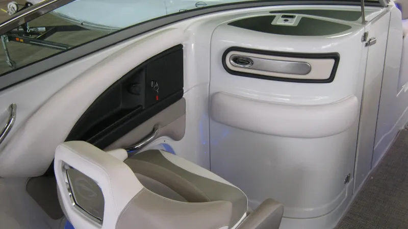 Slide: The Image of Interior view of a 2015 Crownline 285 SS boat, featuring sleek seating and modern design. - 15
