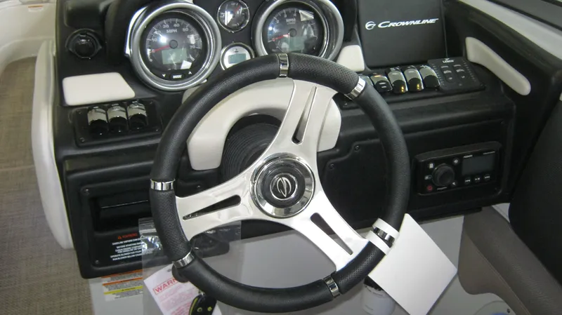 Slide: The Image of Steering wheel and dashboard of 2015 Crownline 285 SS boat. - 16