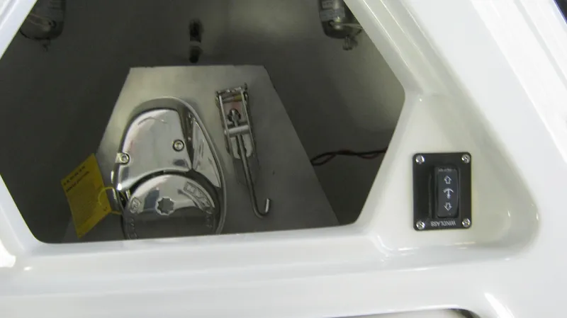 Slide: The Image of 2015 Crownline 285 SS boat anchor compartment with control panel. - 18
