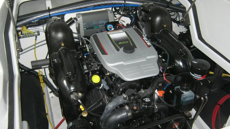 Slide: The Image of Engine compartment of a 2015 Crownline 285 SS boat, showcasing detailed mechanical components. - 22