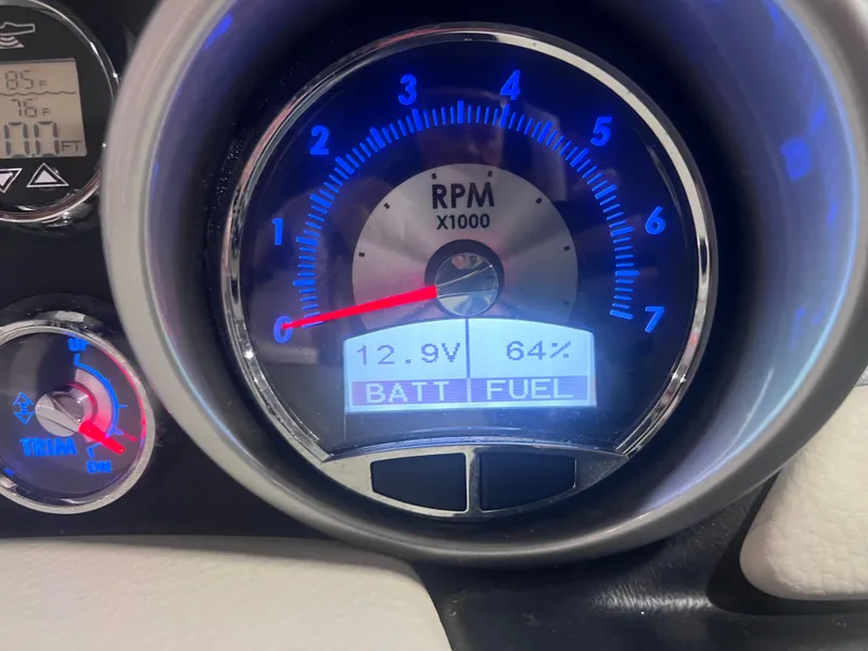Slide: The Image of Crownline 285 SS 2015 dashboard showing RPM, battery voltage, and fuel level. - 26