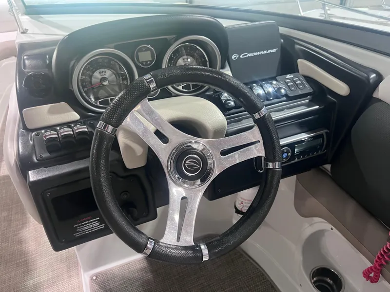Slide: The Image of Steering wheel and dashboard of 2015 Crownline 285 SS boat. - 35