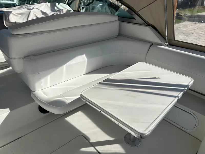 Slide: The Image of 2001 Formula 41 PC yacht interior with white seating and table. - 10
