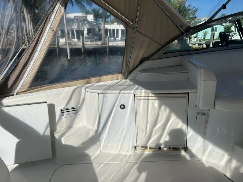Slide: The Image of 2001 Formula 41 PC yacht interior with seating and storage, dockside view. - 11