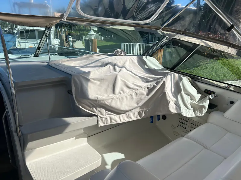 Slide: The Image of 2001 Formula 41 PC boat interior with covered dashboard and seating area. - 17