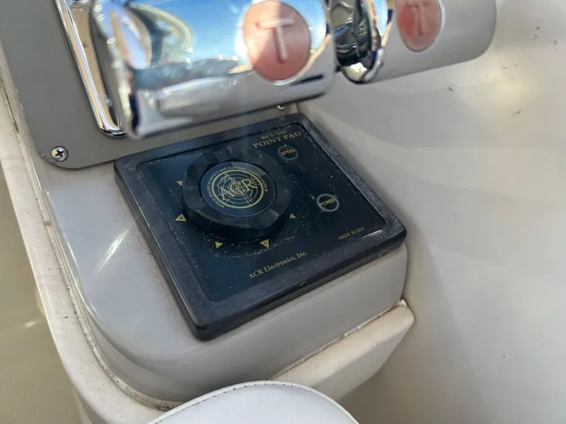 Slide: The Image of Control panel of a 2001 Formula 41 PC boat with navigation controls. - 30