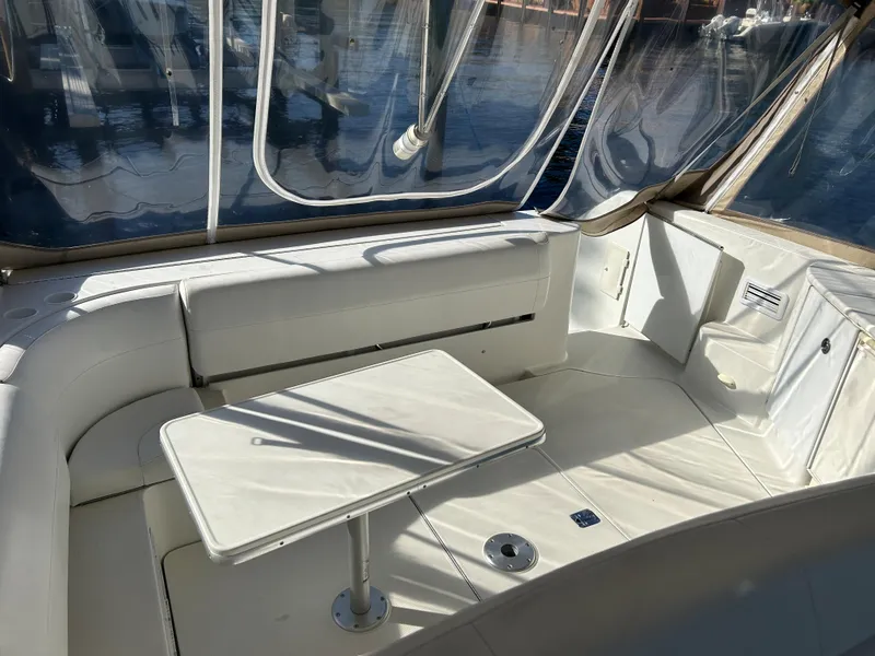 Slide: The Image of Interior view of 2001 Formula 41 PC yacht with white seating and table. - 32