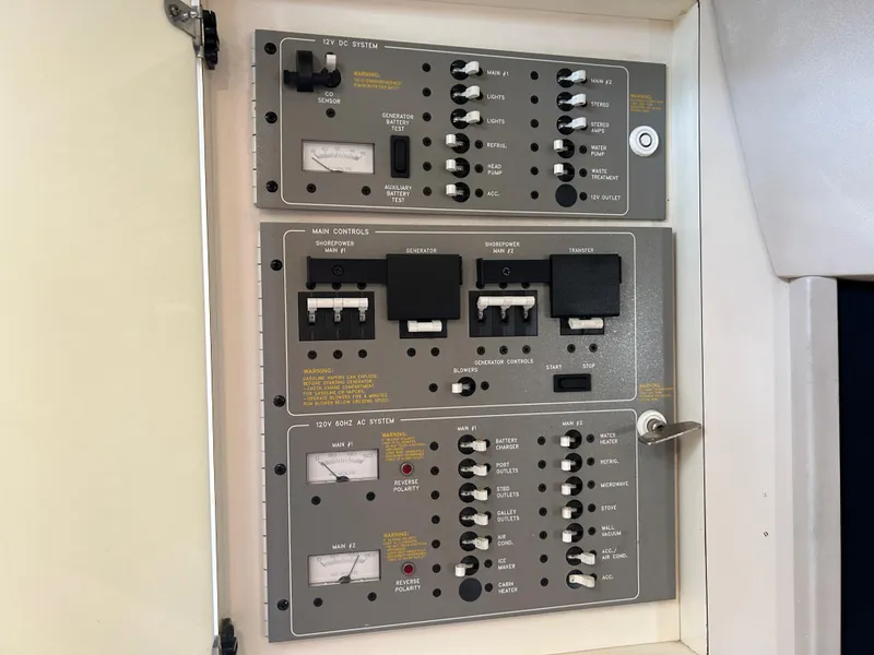Slide: The Image of Electrical control panel of a 2001 Formula 41 PC boat, featuring switches and meters. - 42