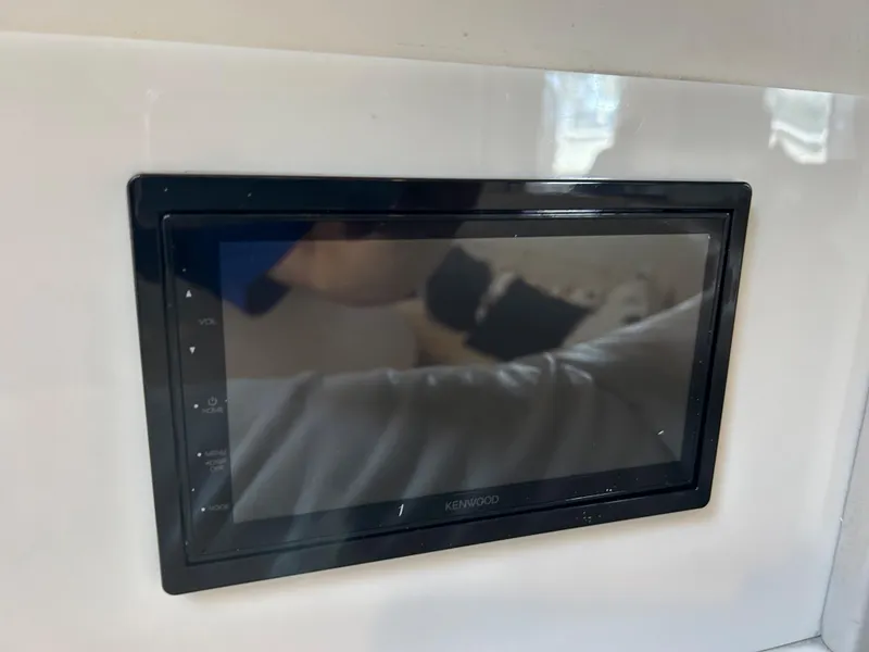Slide: The Image of Kenwood touchscreen display in a 2001 Formula 41 PC boat interior. - 43
