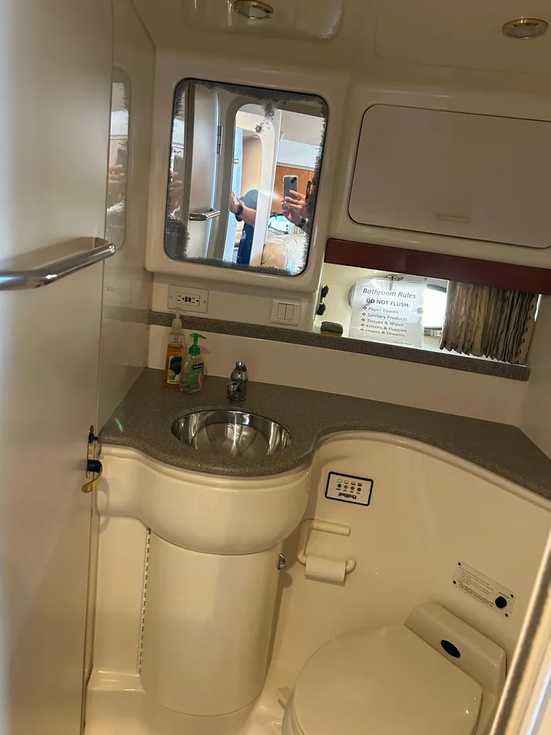 Slide: The Image of 2001 Formula 41 PC yacht bathroom with sink, mirror, and toilet. - 49