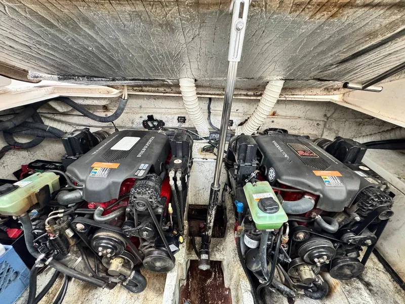Slide: The Image of Engine room of a 2006 Rinker 342 Express Cruiser with dual engines. - 19