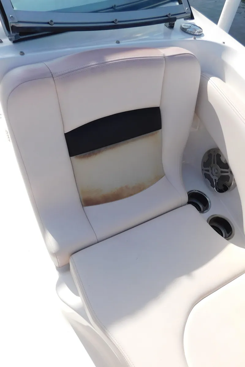 Slide: The Image of 2017 Chaparral 244 Sunesta boat seat with cup holders and speaker. - 14