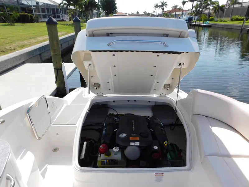 Slide: The Image of 2017 Chaparral 244 Sunesta boat engine compartment open at dockside. - 21