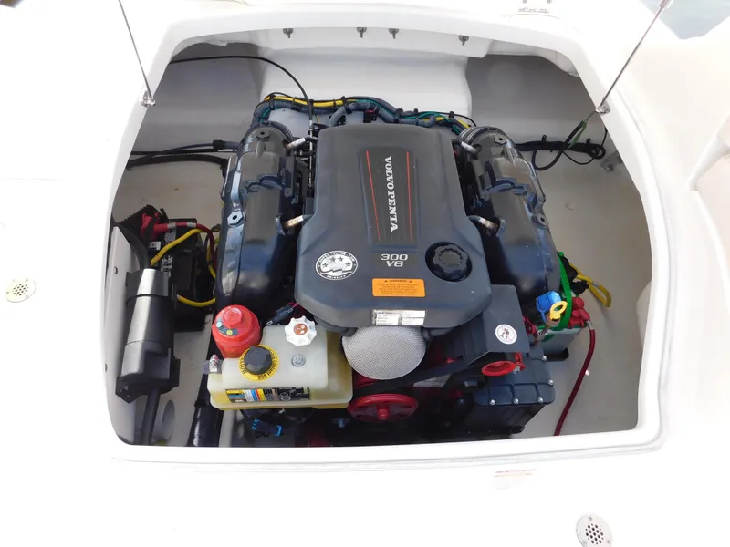 Slide: The Image of Engine compartment of 2017 Chaparral 244 Sunesta boat, showcasing a powerful motor. - 22