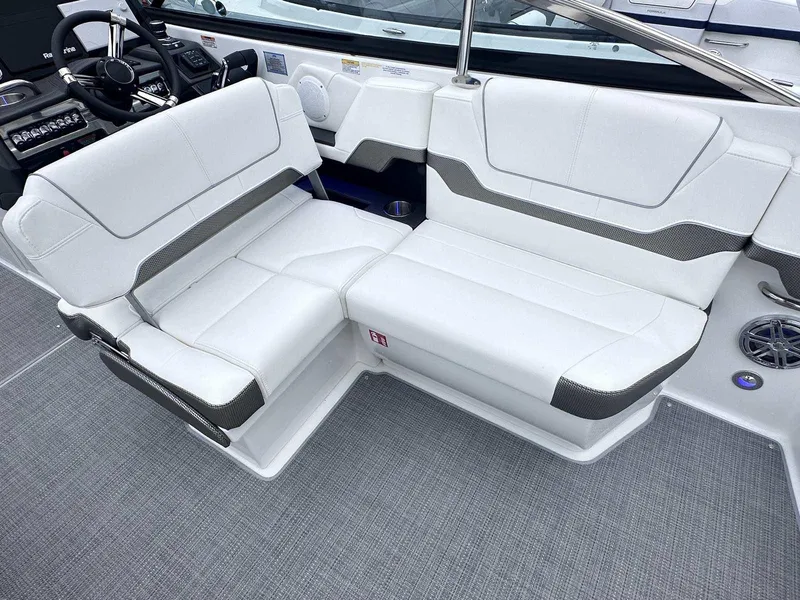 Slide: The Image of 2025 Formula 290 Bowrider interior with white seating and modern dashboard. - 10