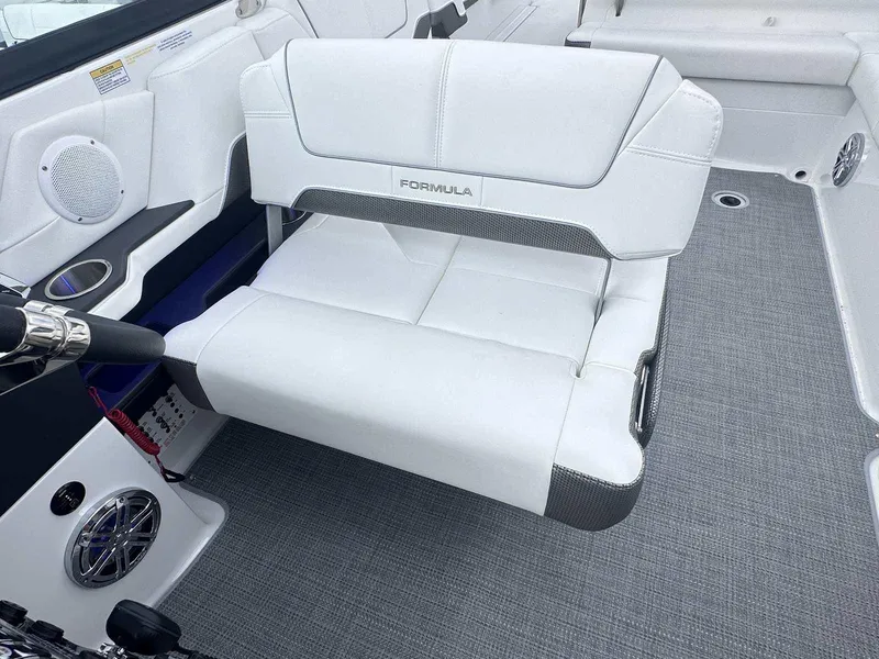 Slide: The Image of 2025 Formula 290 Bowrider interior with white seating and modern dashboard. - 13