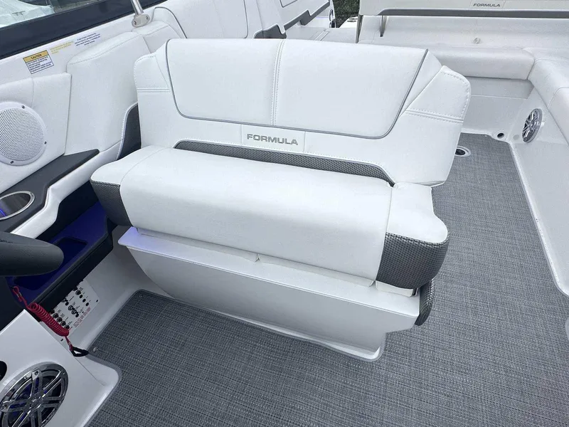 Slide: The Image of 2025 Formula 290 Bowrider interior with white seating and modern design. - 14