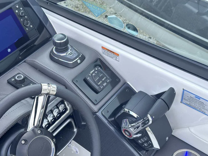 Slide: The Image of 2025 Formula 290 Bowrider dashboard with steering wheel and control panel. - 18