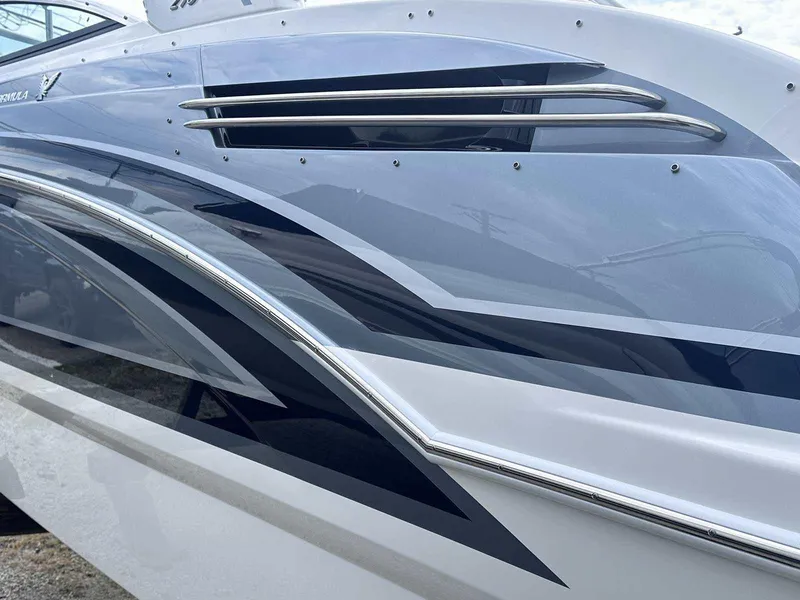 Slide: The Image of 2025 Formula 290 Bowrider boat with sleek, modern design and stylish graphics. - 2