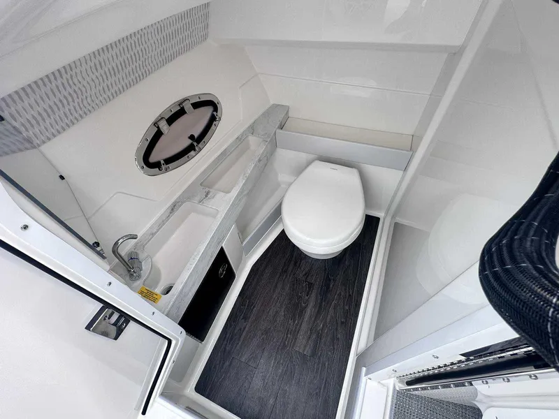 Slide: The Image of 2025 Formula 290 Bowrider bathroom with modern fixtures and sleek design. - 23
