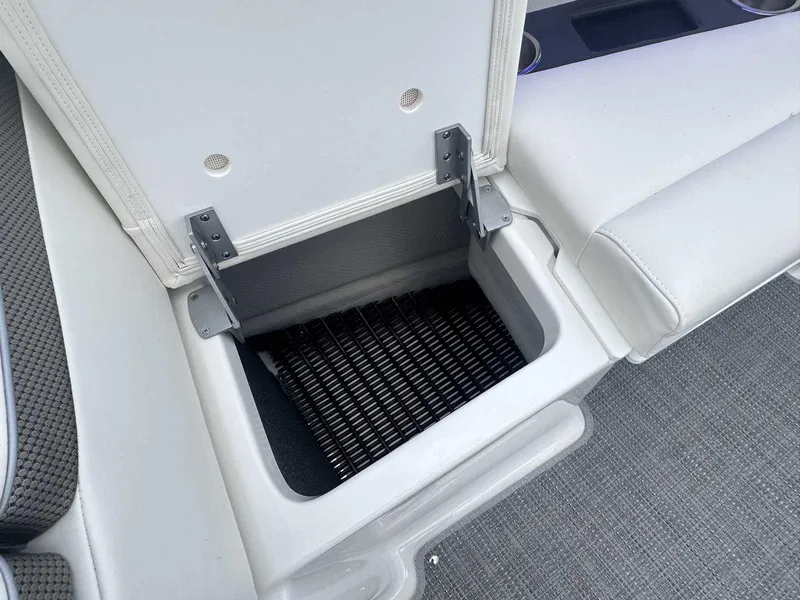 Slide: The Image of 2025 Formula 290 Bowrider storage compartment with open lid, showcasing interior space. - 32