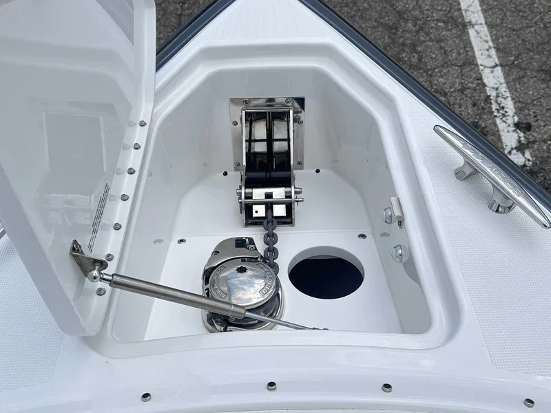 Slide: The Image of 2025 Formula 290 Bowrider anchor compartment with chain and winch system. - 34
