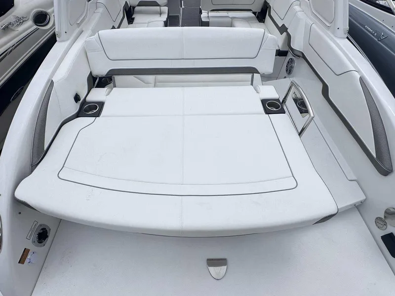 Slide: The Image of 2025 Formula 290 Bowrider interior with white seating and cup holders. - 5