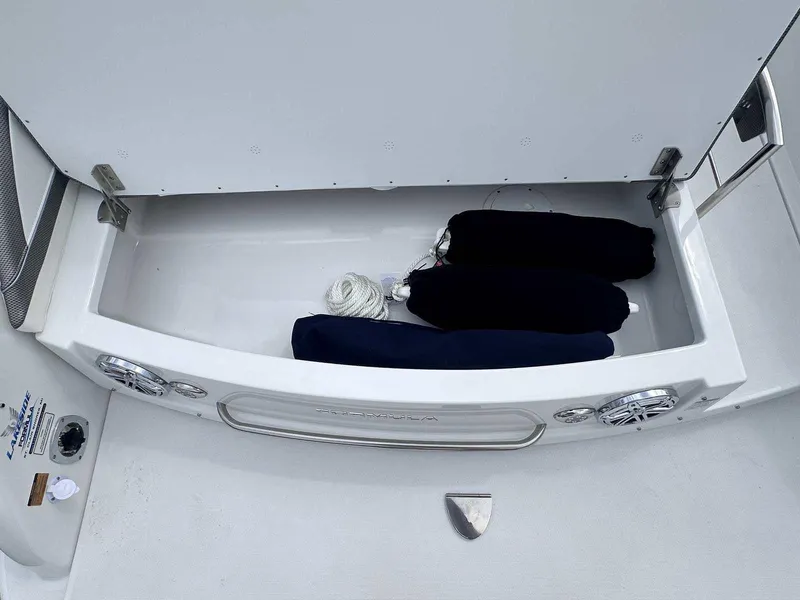 Slide: The Image of 2025 Formula 290 Bowrider storage compartment with ropes and fenders. - 6