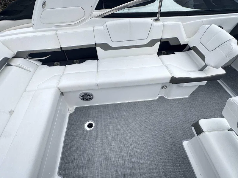 Slide: The Image of 2025 Formula 290 Bowrider interior with white seating and gray flooring. - 8