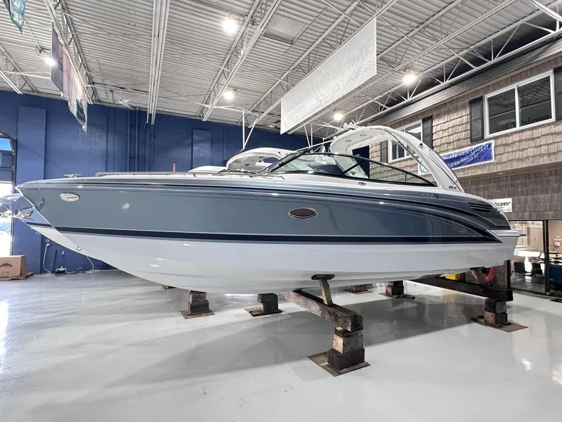 The Image of 2025 Formula 290 Bowrider boat displayed indoors on stands. - 0