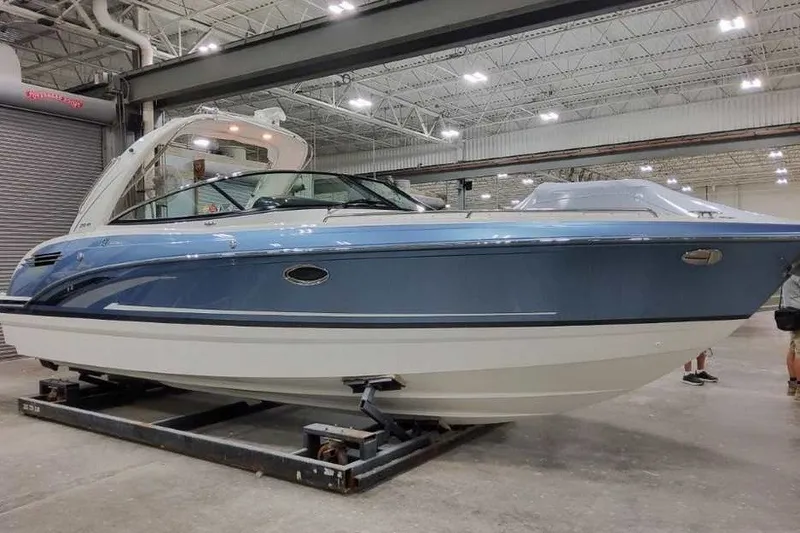 Slide: The Image of 2027 Formula 290 Bowrider boat in a spacious indoor showroom. - 2